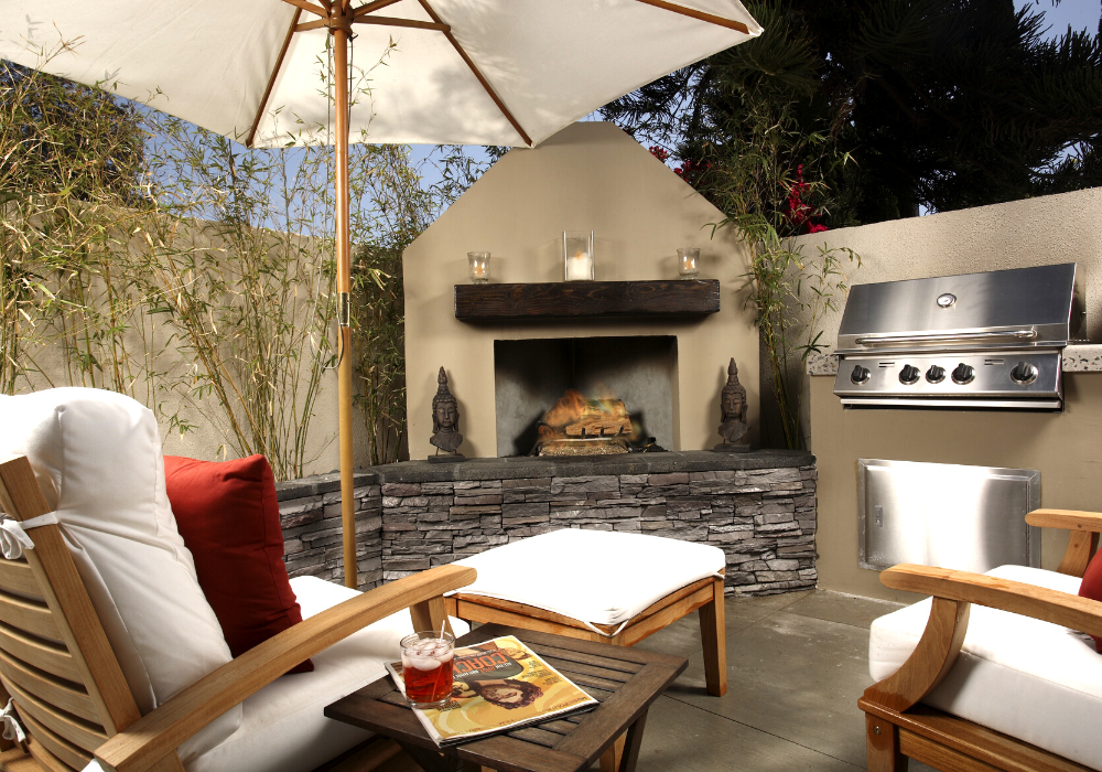 outdoor kitchen with a fireplace