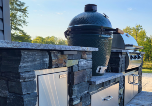 an outdoor kitchen design including FireMagic and Big Green Egg