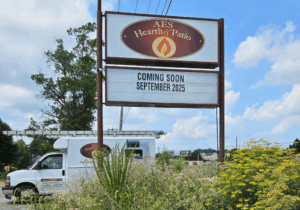 a van parked in front of a restaurant sign