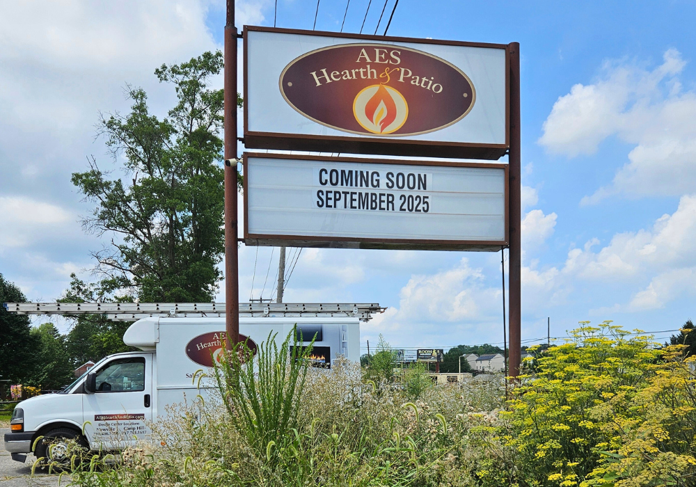 a van parked in front of a restaurant sign
